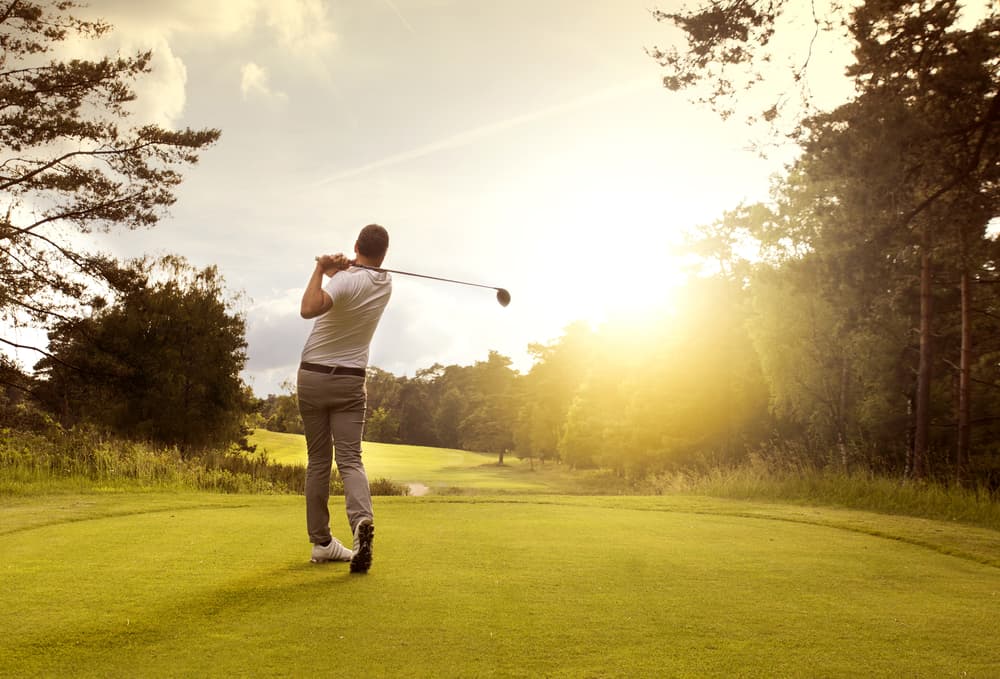 Man_Playing_Golf_In_Sun